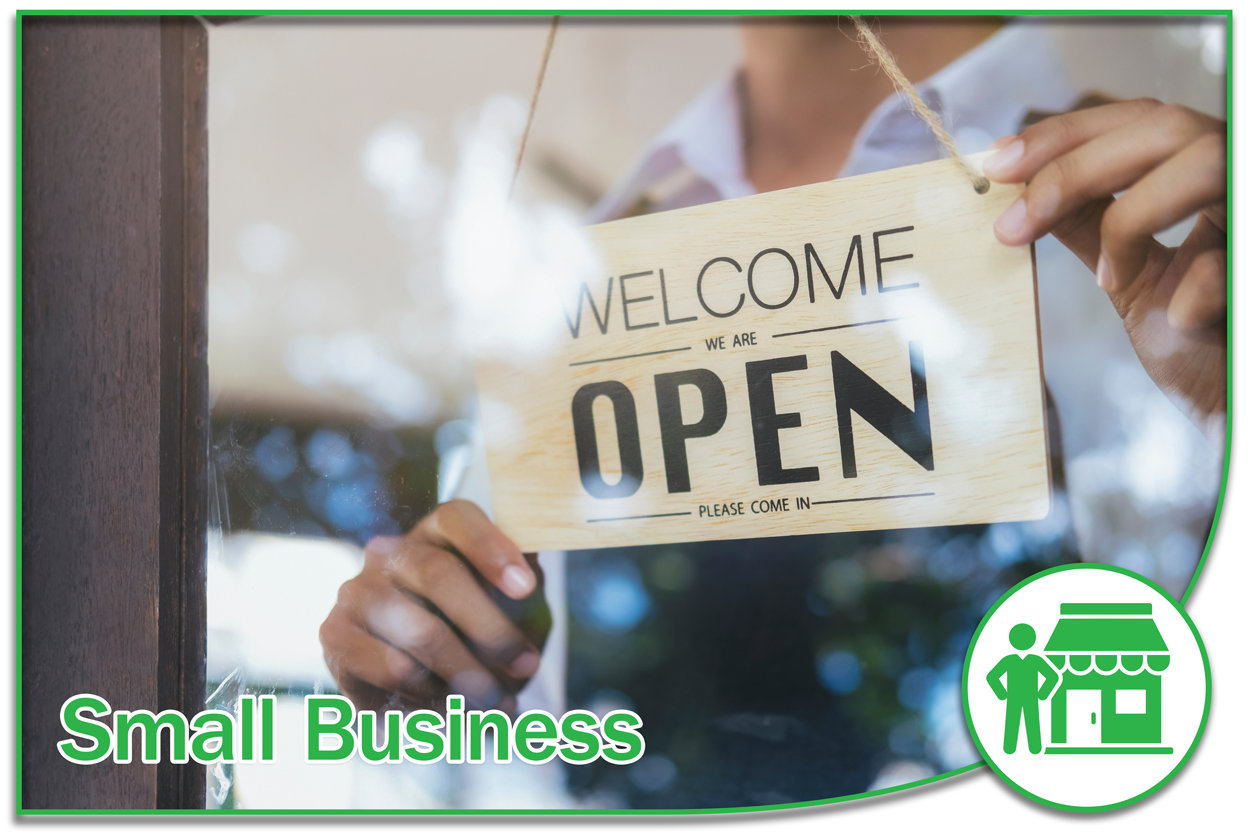 Image of a store front with the owner turning a sign with the words welcome we are open in the front window.